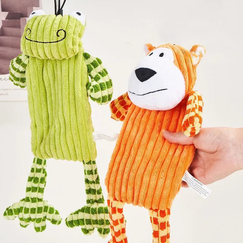 Green and orange durable rubber dog toy with squeaker for aggressive chewers.