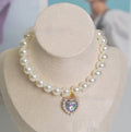 Decorative cat collar with plastic alloy resin construction and central gemstone charm in multiple colour options