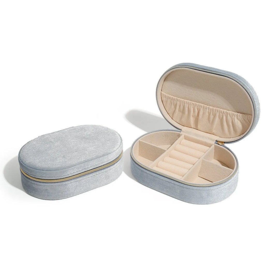 Oval velvet jewellery storage box in multiple colours with flannel interior, showing dimensions 15x10x5cm.