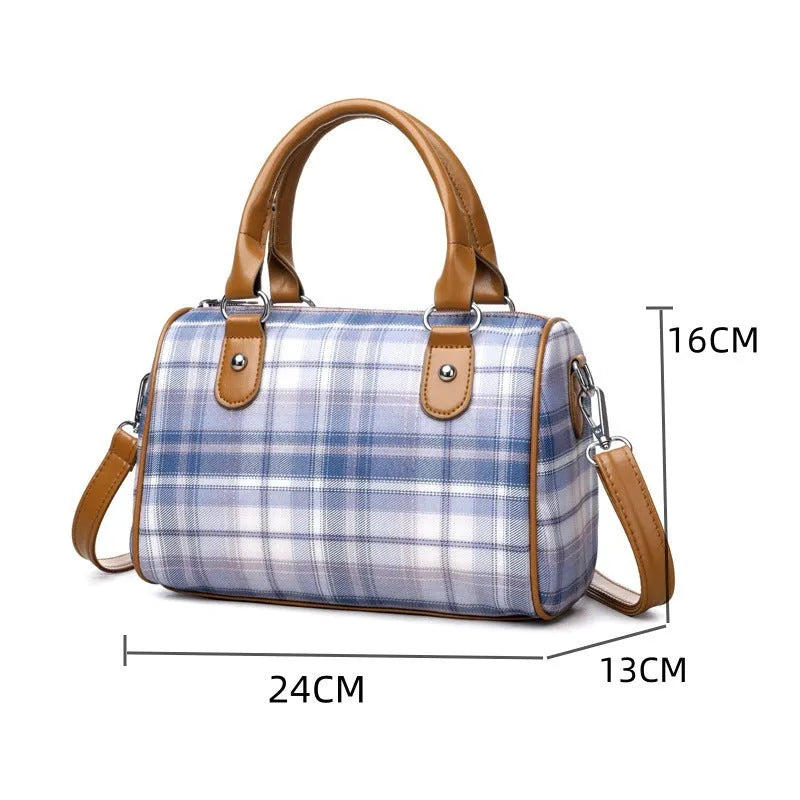 Plaid academy style round barrel canvas shoulder bag with three-dimensional pocket, available in blue plaid.