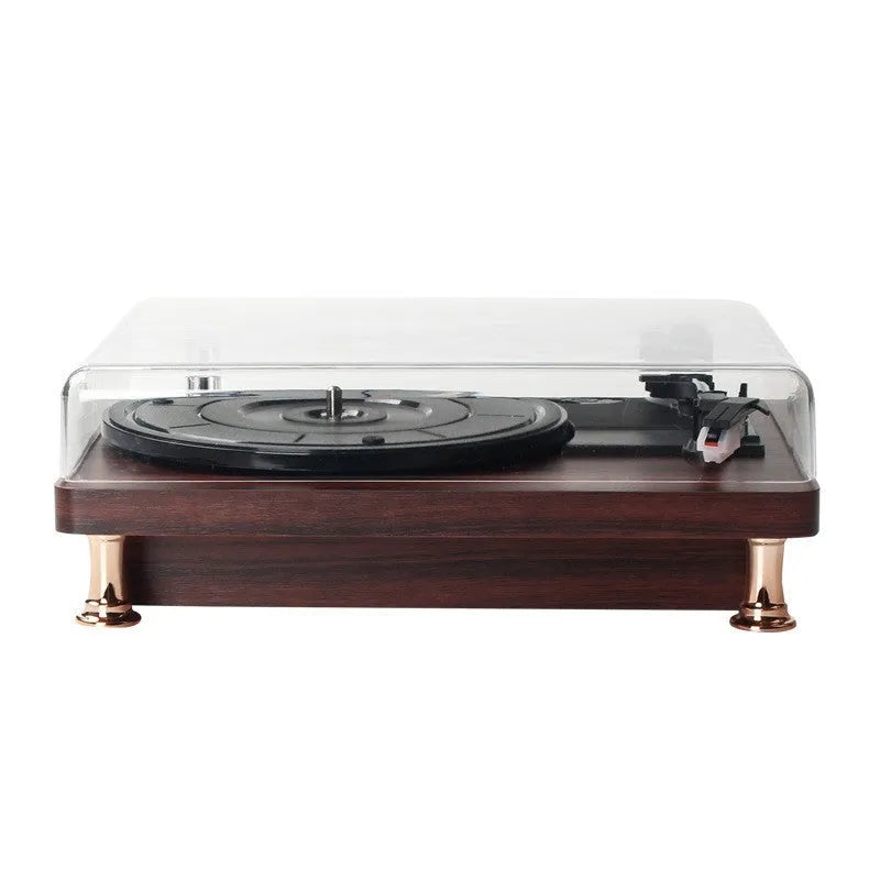 Retro vinyl record player with wood grain finish, transparent dust cover, and built-in speaker