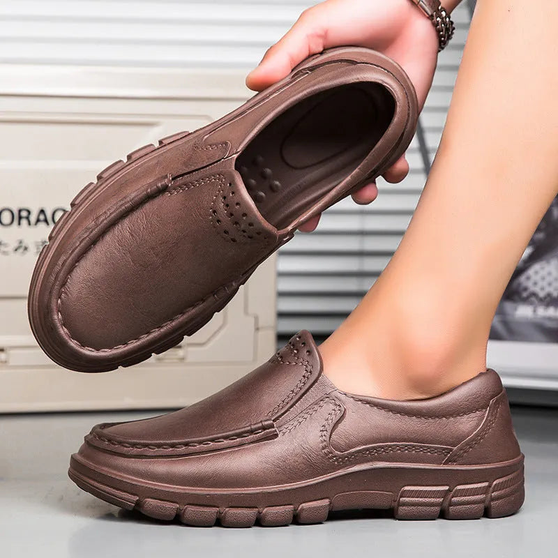Men's black slip-on work shoes with a platform sole and round toe.