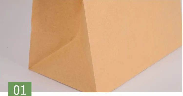Yellow kraft paper tin foil bag with inner aluminium layer for snack food packaging.