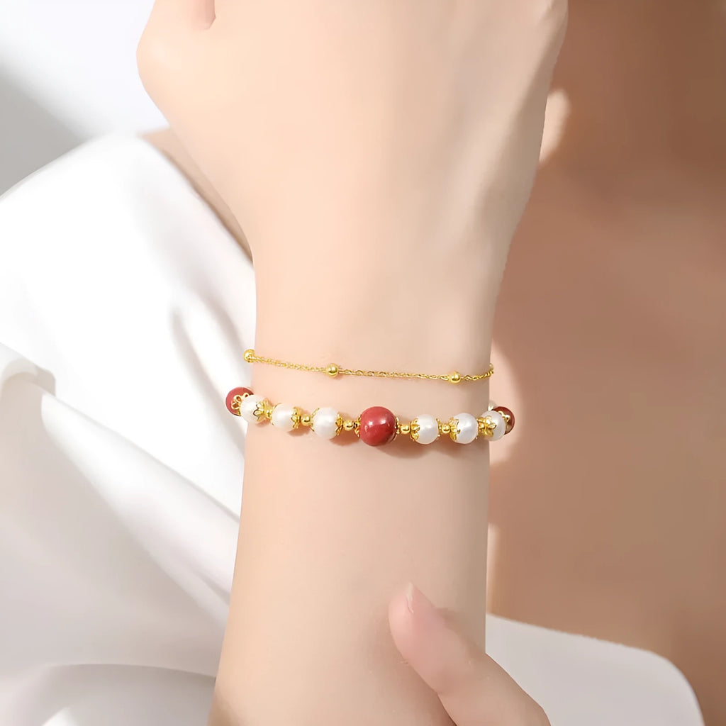 Sterling silver double-layer bracelet with white freshwater pearls and red cinnabar bean charms