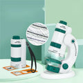 Portable white and green plastic microscope set with specimen slides for educational science exploration.