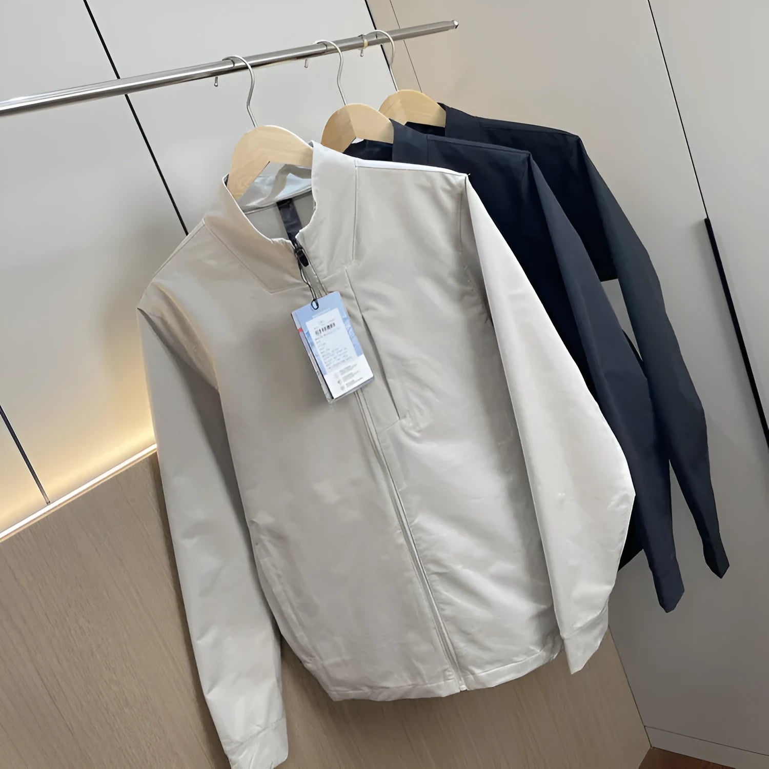 Man wearing a stand collar straight hem casual sports jacket in polyester fabric.
