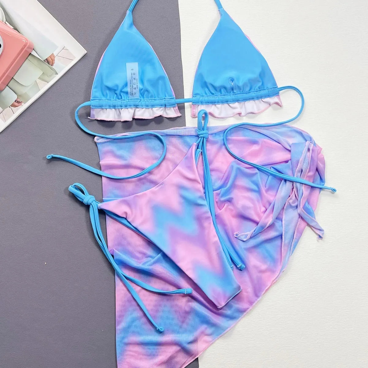 Women's tie-dye bikini swimsuit with split-front design and matching bra and briefs
