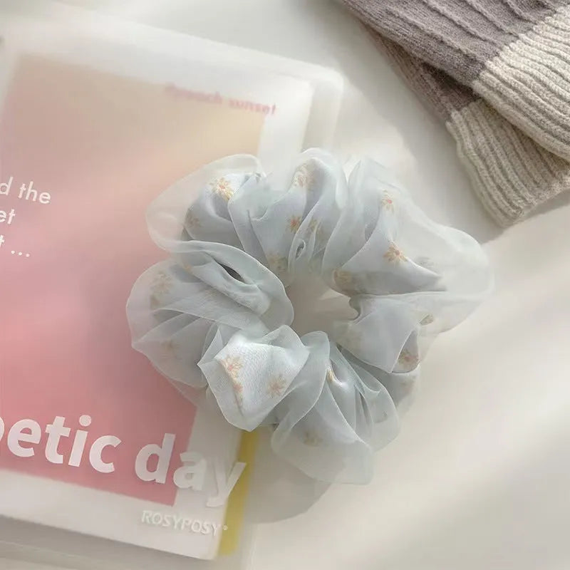 Mesh sense bun cloth hair band for women in milky white, pink, and light blue with large intestine style