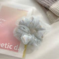 Mesh sense bun cloth hair band for women in milky white, pink, and light blue with large intestine style