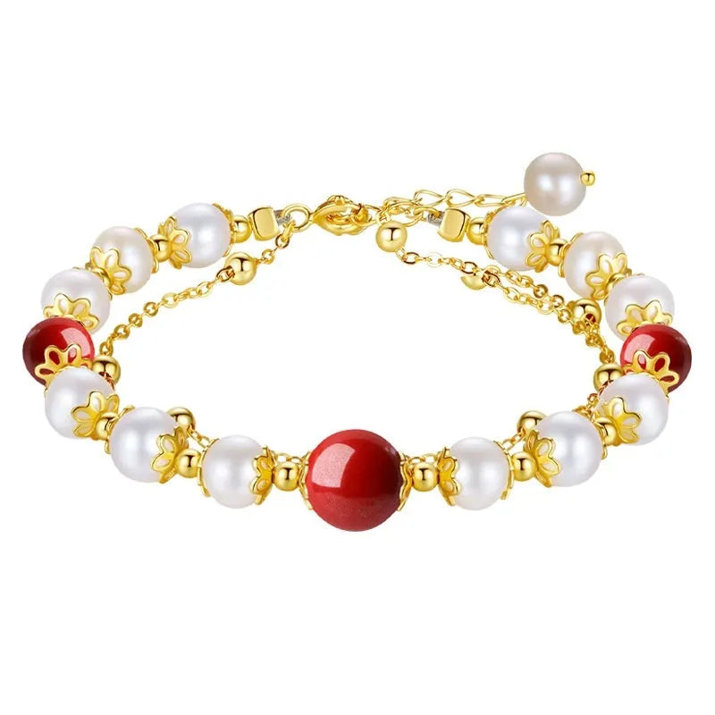 Sterling silver double-layer bracelet with white freshwater pearls and red cinnabar bean charms