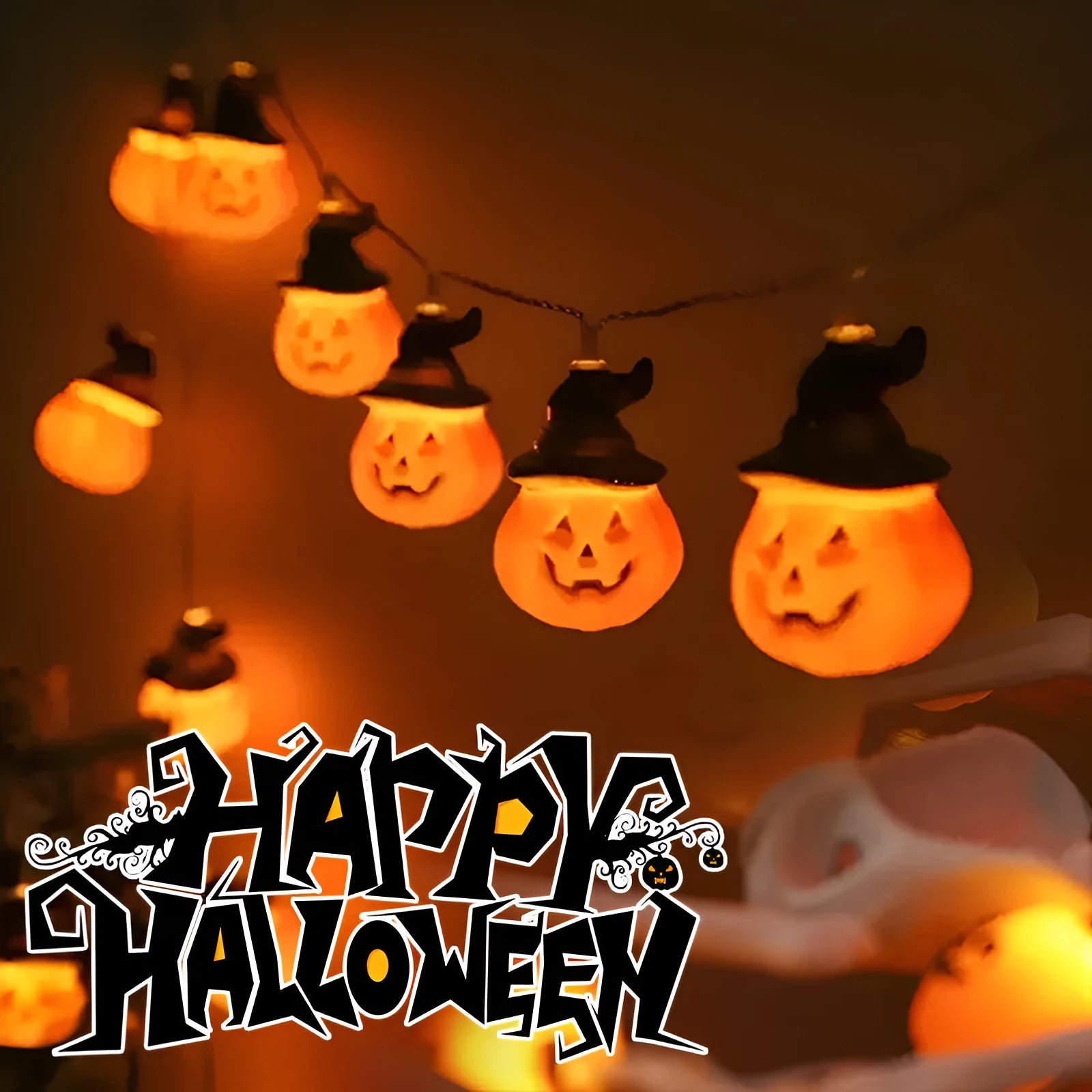 PVC Halloween lighting chain with pumpkin, ghost and bat shapes in warm white LED glow