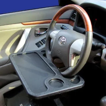 Multifunctional car desk in black ABS, 425 x 285 x 25mm, mounted on car steering wheel with adjustable angle.