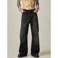 Black straight-leg jeans with retro styling and loose fit on man