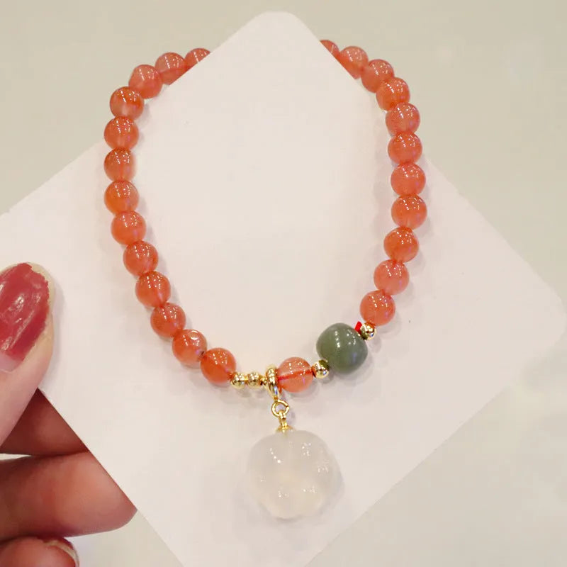 Natural red agate bracelet with zodiac animal and cat paw charms, gem inlays, 8mm bead size