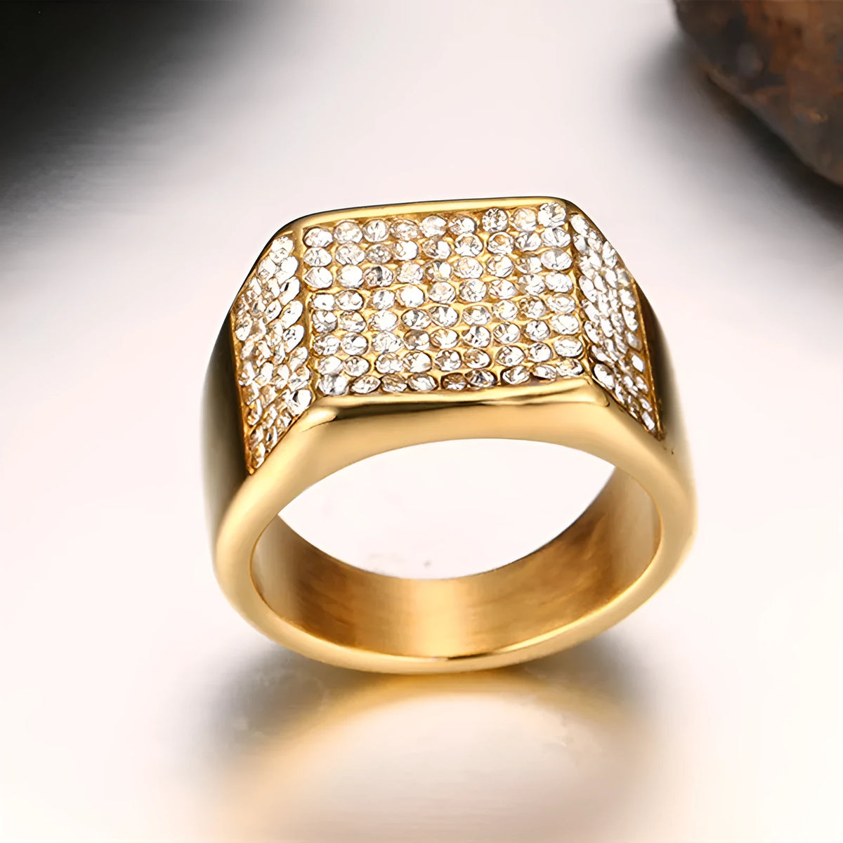 Gold titanium steel men's ring with geometric diamond-treated surface, available in sizes 7 to 12.