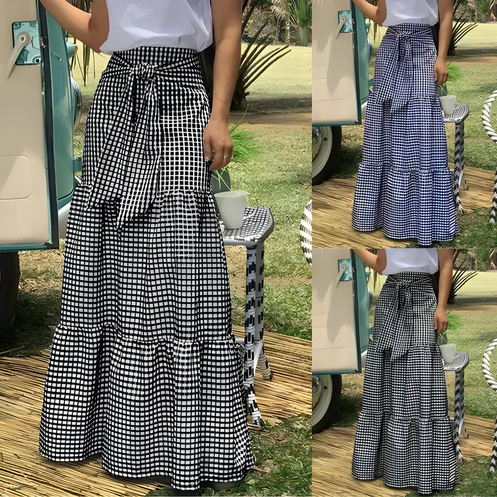 Ruffled hem strappy pleated casual loose skirt in black or blue polyester, sizes S to 3XL.