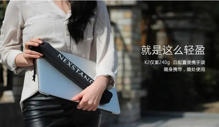Sagacious black foldable laptop stand made of enhanced nylon, shown open and next to its portable carry bag.