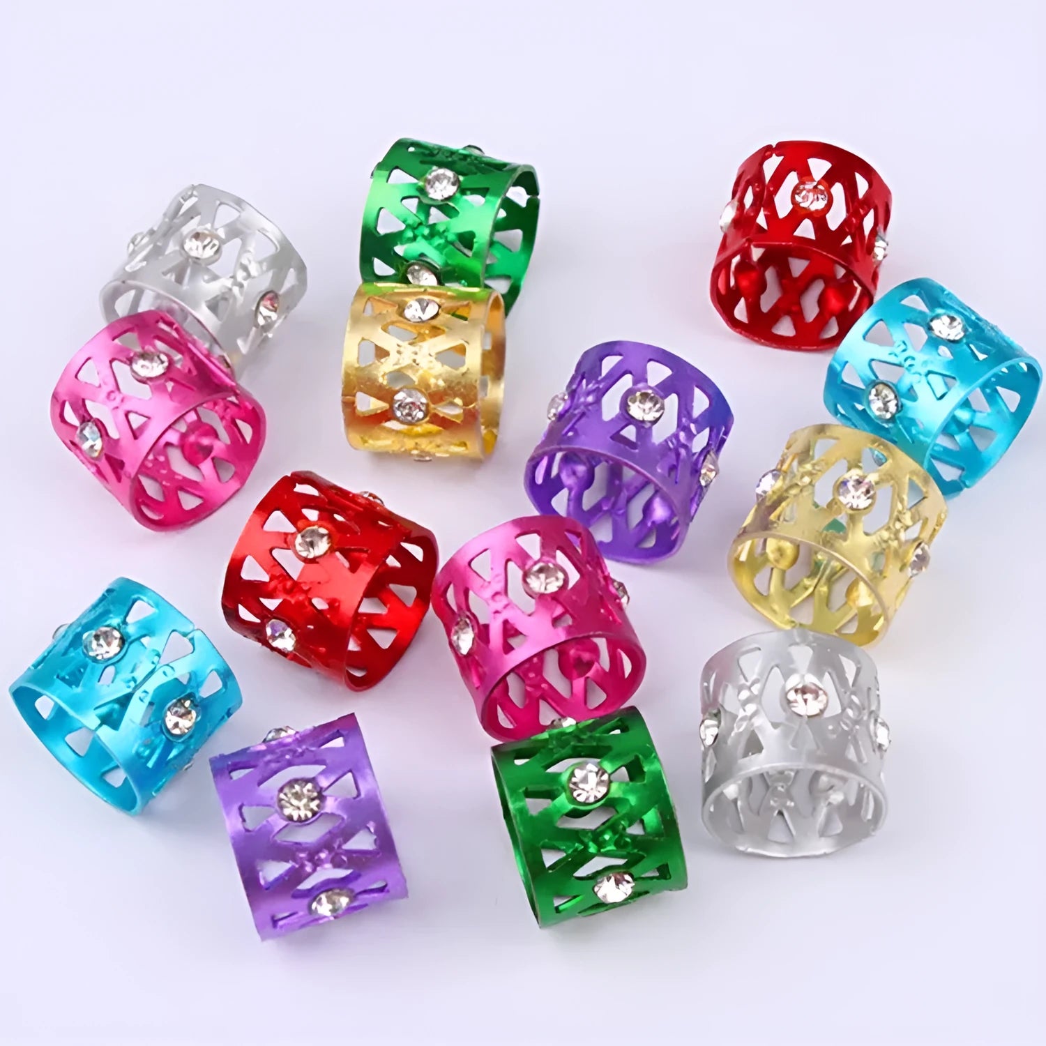 Aluminium wig decoration hair ring with jeweled details in multiple colour options on a white background.