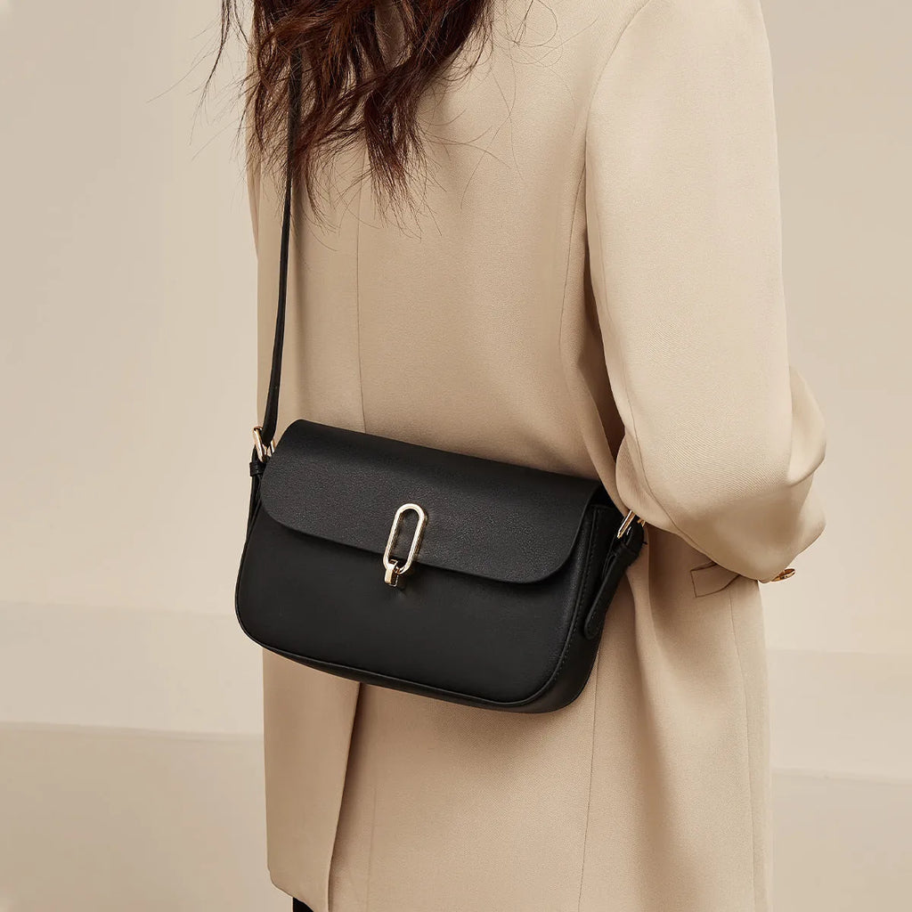 Black genuine leather square messenger bag with lock closure and shoulder strap