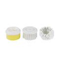 White rechargeable electric cleaning brush with three interchangeable nylon brush heads on a bathroom sink.