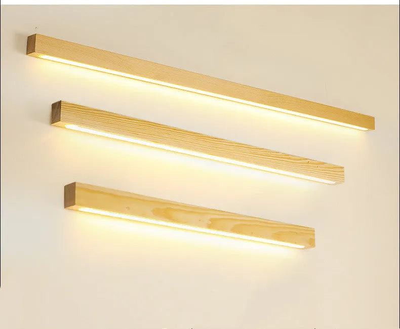 Modern wooden log strip wall lamp mounted on a wall in walnut colour