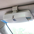 Car glasses case clipped onto sun visor, 170x70x55mm, silver coated tape and steel wire construction