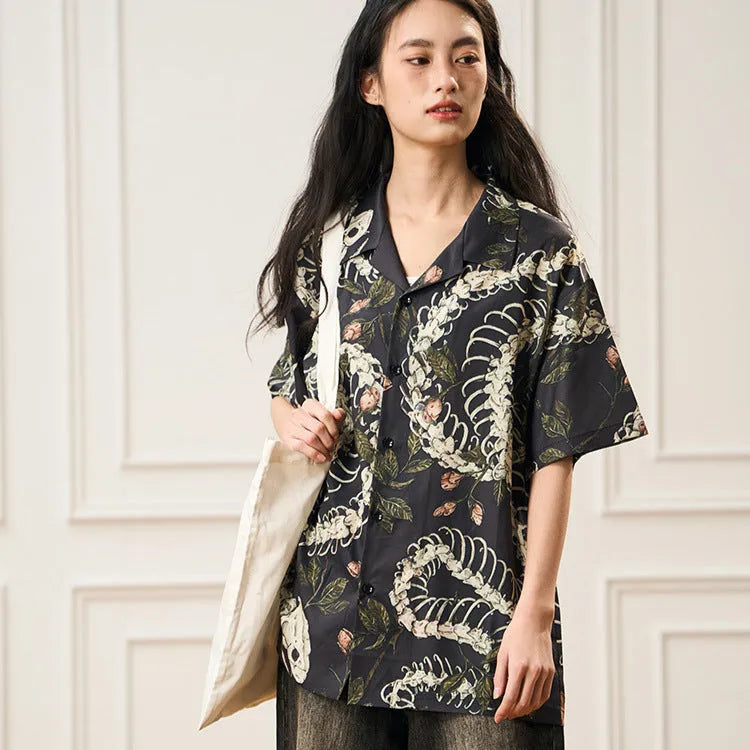 Original designer snake bone pattern printed on a short sleeve Cuban collar shirt in loose fit.