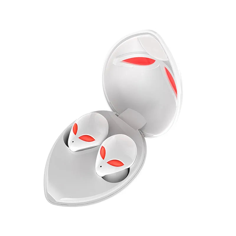 Creative Outer T8 Starman alien design Bluetooth earbuds with LED lights next to wireless charging case.