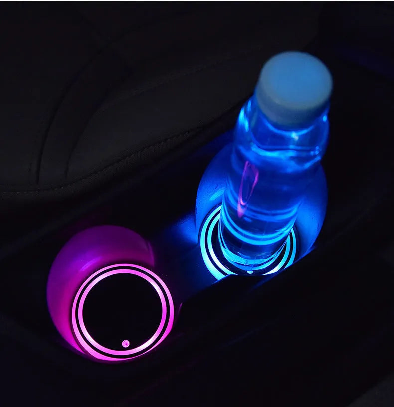 Colourful LED light-up car cup holder coaster with solar panel and USB charging port.