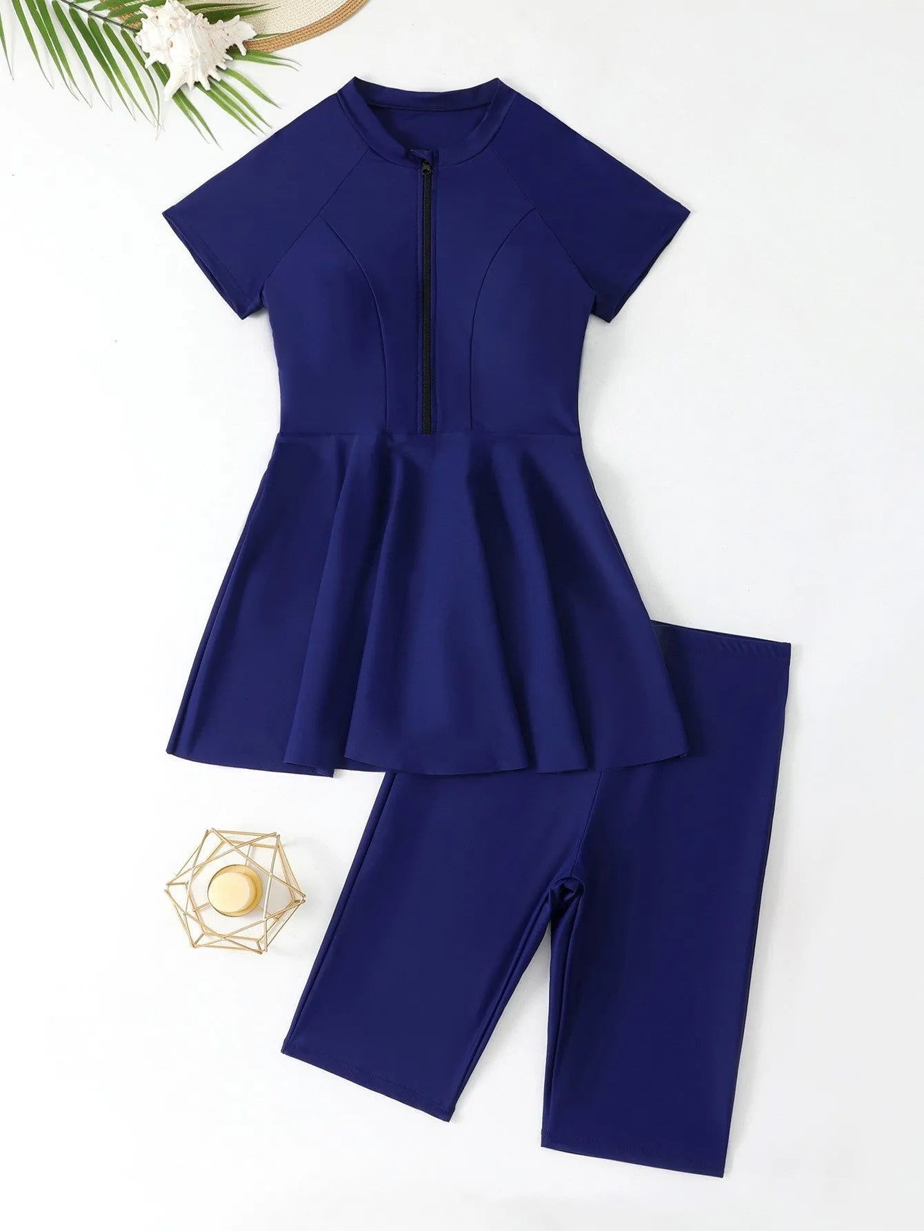 Women's black split two-piece swimsuit with short sleeves, shorts, and zipper front for sun protection.