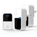 White plastic wireless doorbell kit with plug-in chime and self-powered button, shown with EU and US plugs.