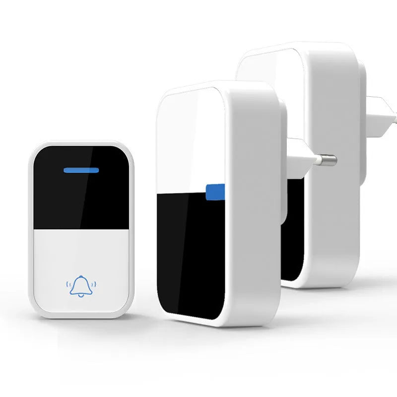 White plastic wireless doorbell kit with plug-in chime and self-powered button, shown with EU and US plugs.