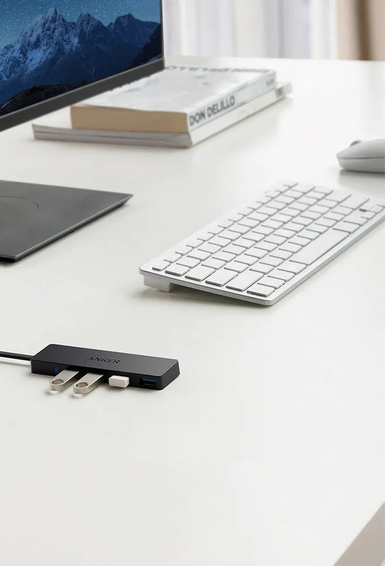 Black Anker 4-port USB 3.0 hub measuring 30x107mm with 20cm connecting cable