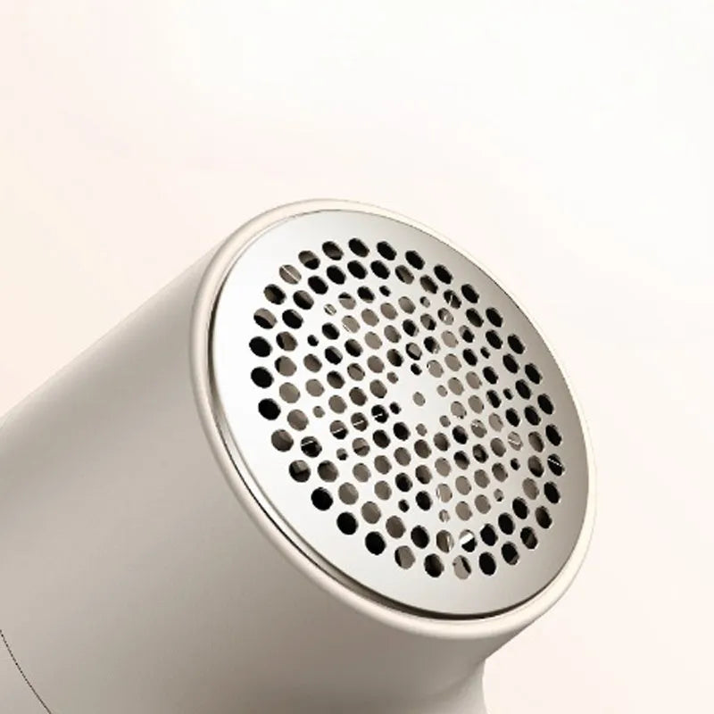 White electric lint remover with LED display and USB charging port for fabric hairball removal