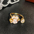 Close-up of a vintage-style adjustable copper ring with a gourd and floral design in a zircon inlaid finish.