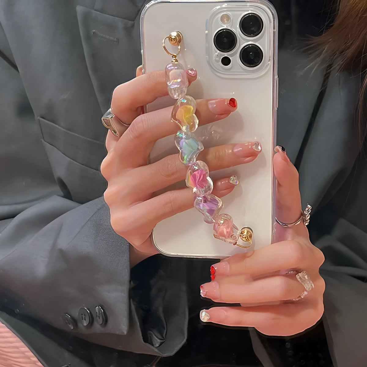 Transparent TPU iPhone case with handmade beaded candy chain and girly heart laser colour design on the back