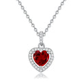 Women's sterling silver heart necklace with a natural gemstone on an adjustable cross chain.