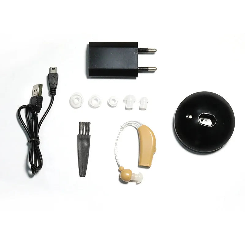 Black rechargeable hearing aid amplifier with silicone earplugs and a charging cable.