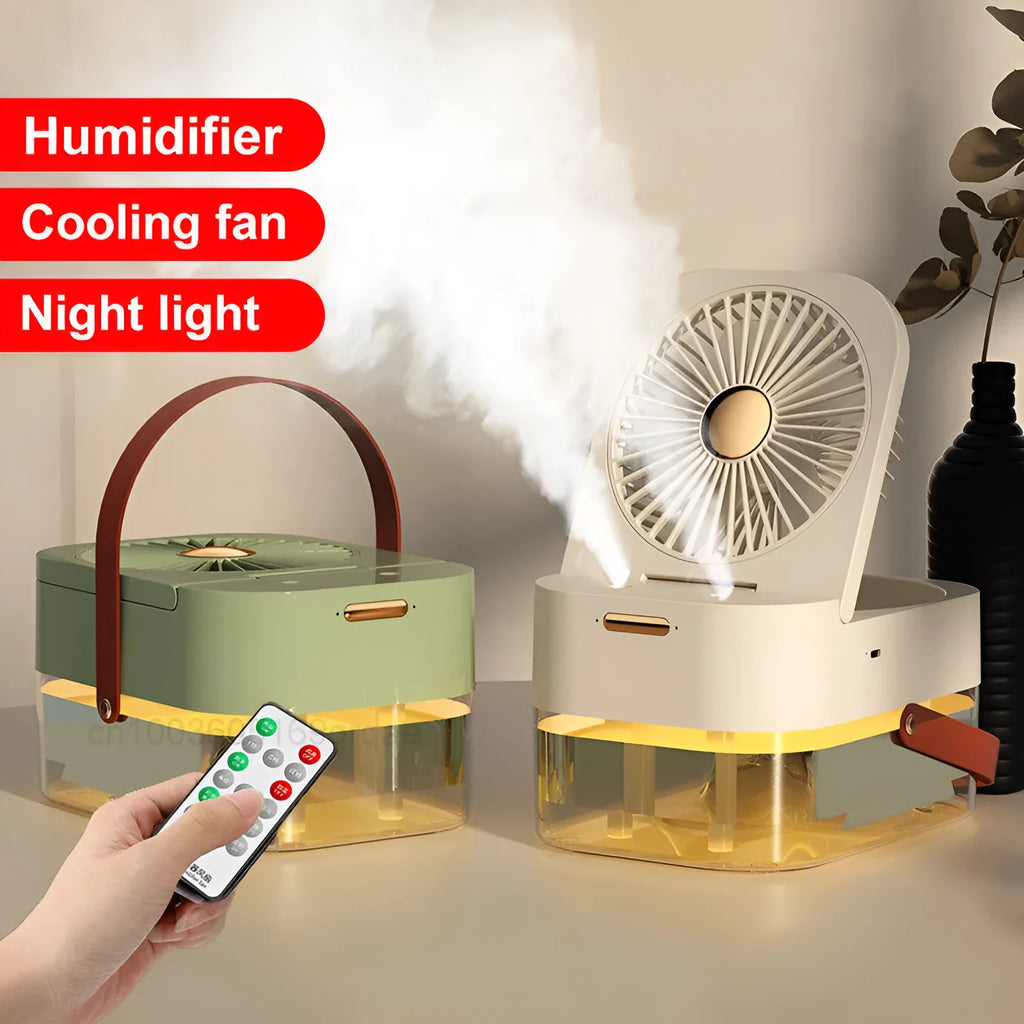White or green USB desktop fan humidifier with remote control on a wooden desk.