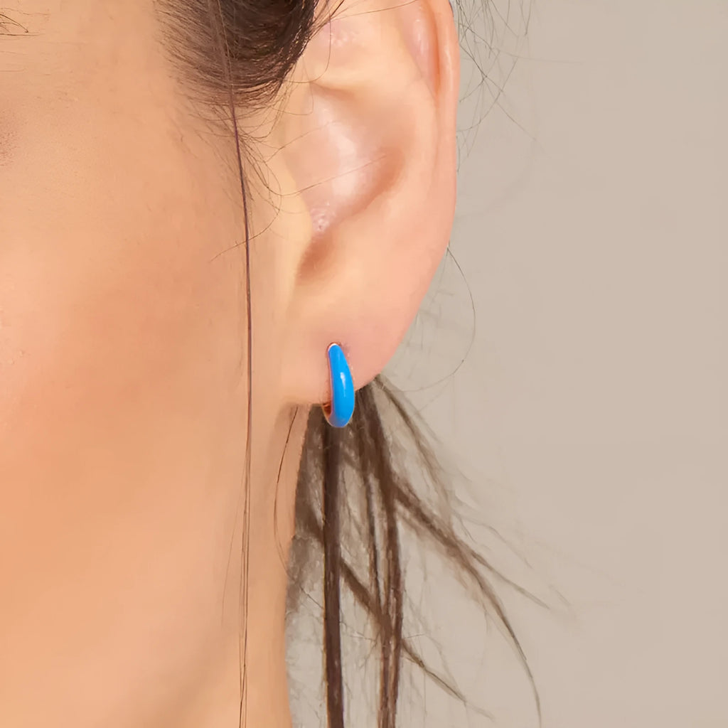 A pair of U-shaped geometric earrings with a glossy oval centre, in a choice of seven epoxy resin colours.