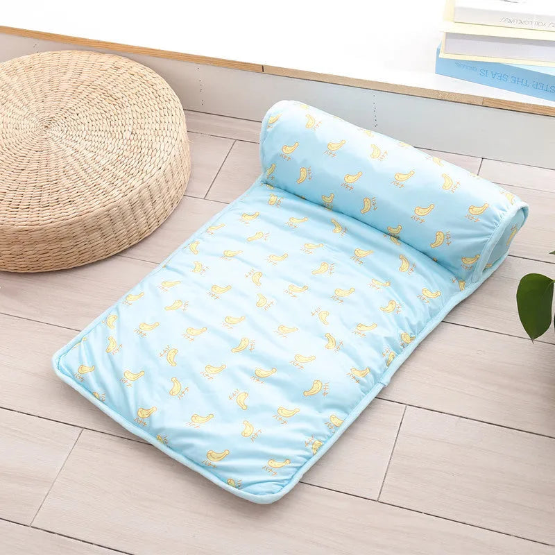 Ice silk cooling pet mat with pillow, non-slip bottom, in pink cherry, blue banana, or green avocado.