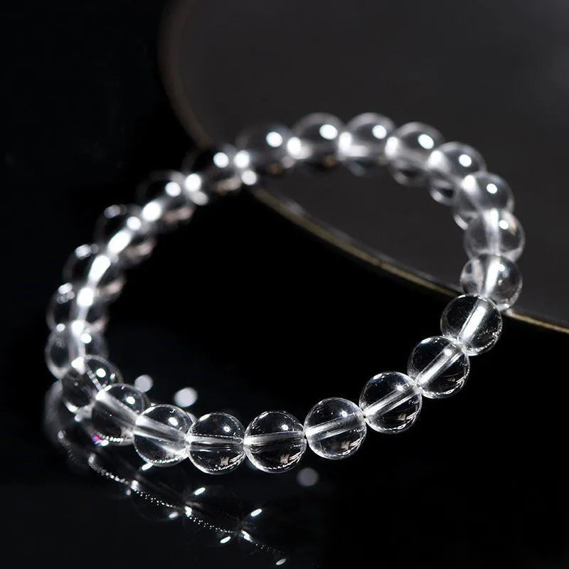 Natural Donghai white crystal round bead bracelet with geometric single circle design on a wrist.