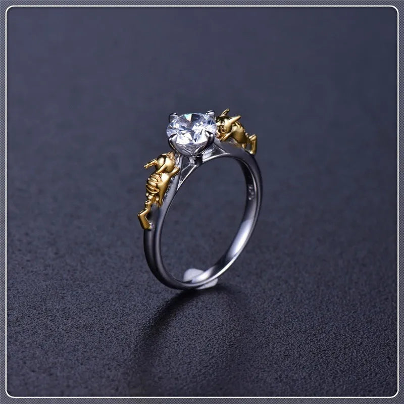 Detailed copper crown ring with crystal accents on a finger, showing black gold and copper finish options.