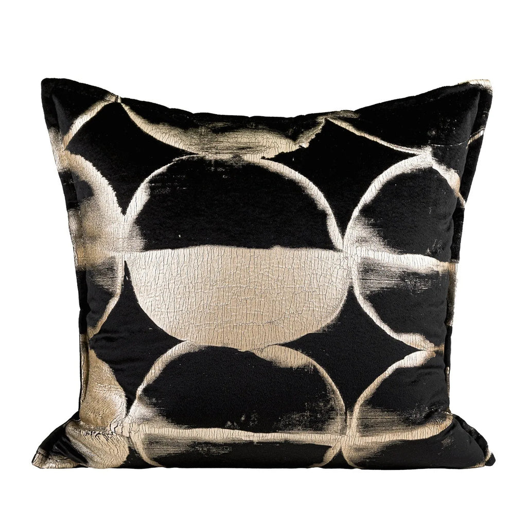 Black and gold abstract full moon pattern flannel cushion on a grey sofa