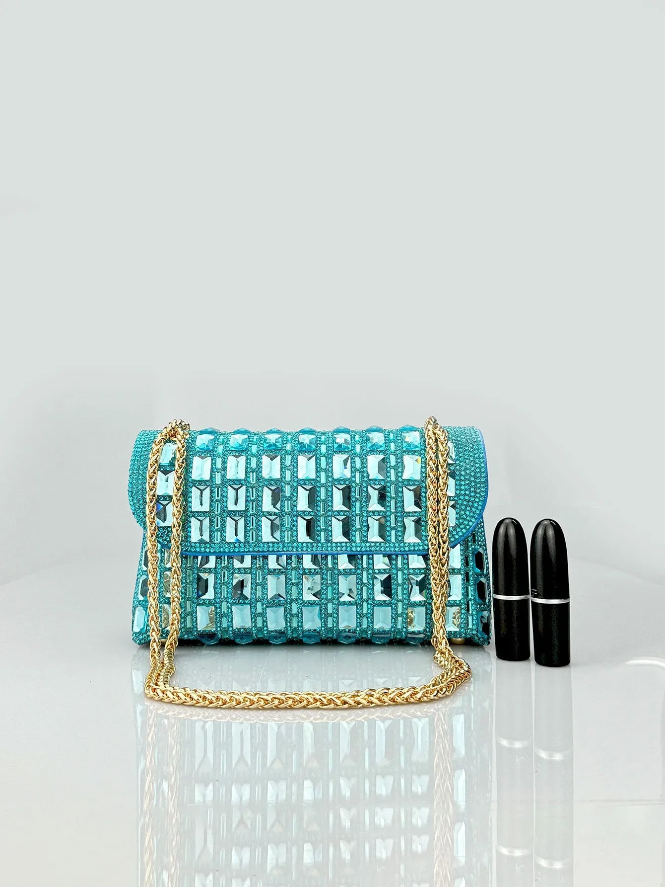 Glass rhinestone chain clutch bag in horizontal square shape with decorative diamonds and chain strap