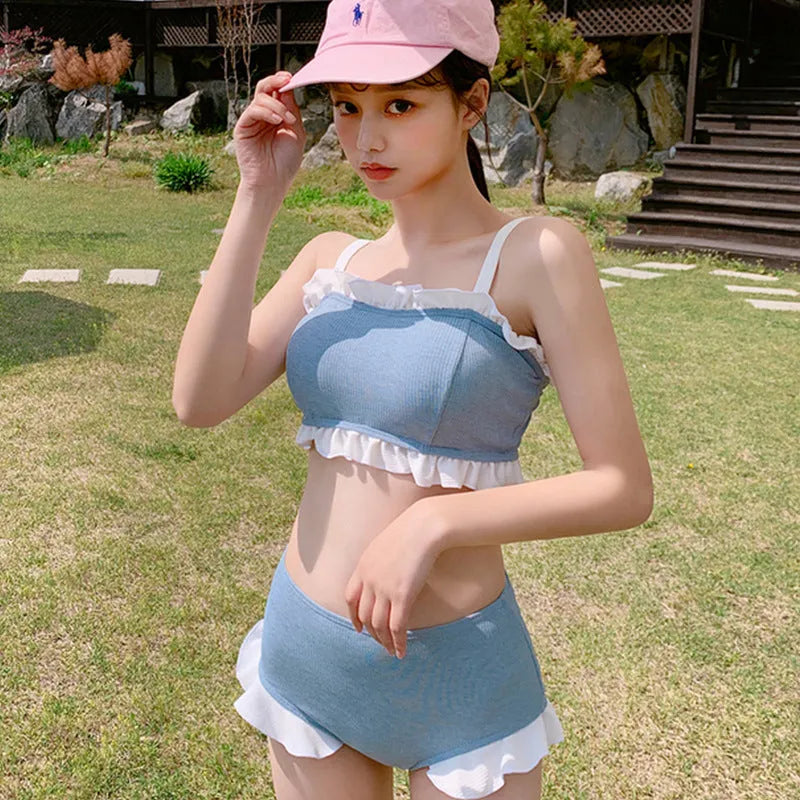 Women's conservative split leg one-piece swimsuit with suspender straps in solid colour