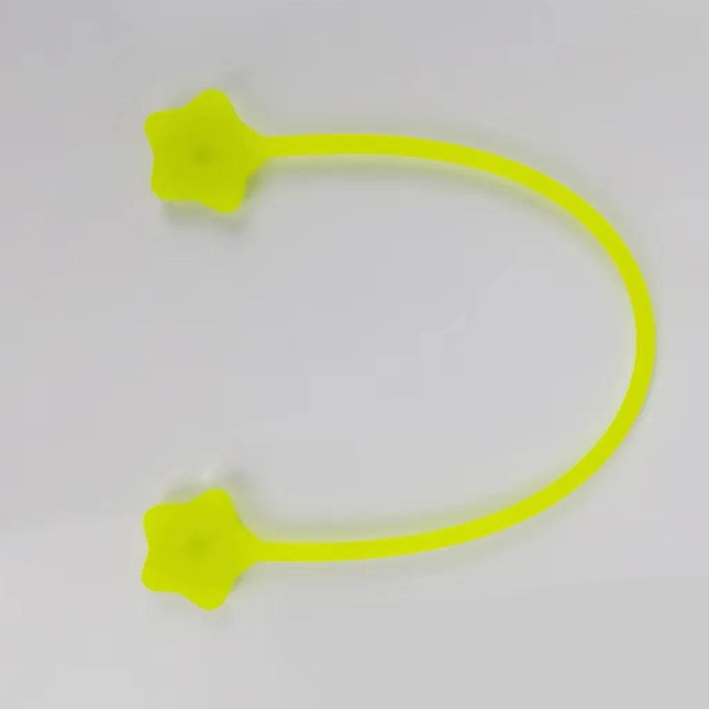 Purple silicone wire winder with magnet holding a coiled white headphone cable.