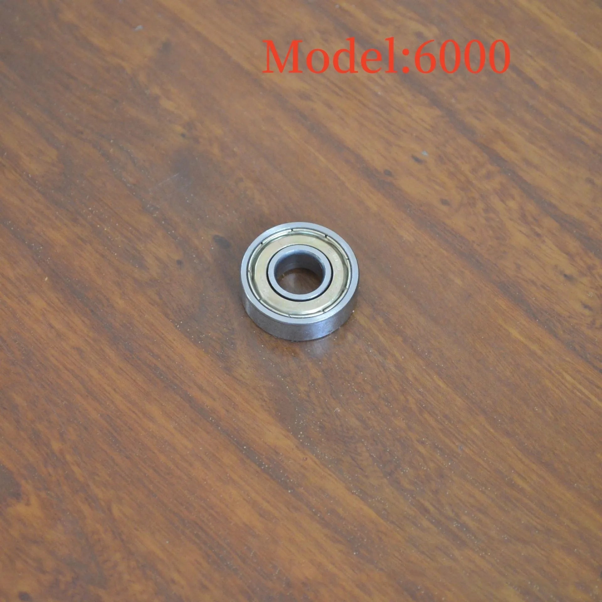 6000z carbon steel ball bearing with 10mm inner diameter, 26mm outer diameter, and 8mm width on a white background.
