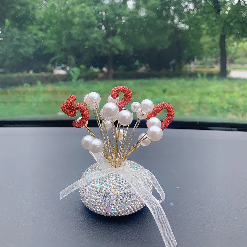 Clay diamond star decoration ornament for a car centre console in a modern colour design.