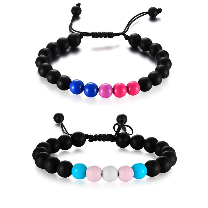 Polished black agate beaded bracelet with 8mm beads, unisex style, on a neutral background.